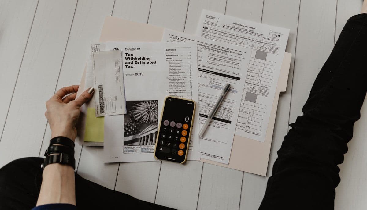 Financial reports and budget documents showing discrepancies across multiple systems